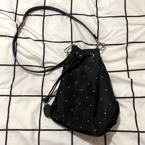 Black bag with green polka dots